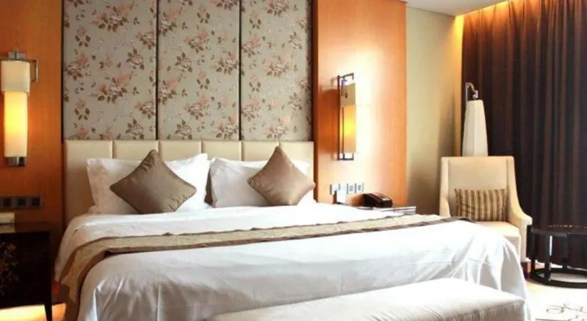 Bed in Zhangjiagang Zhonglian GDH International Hotel