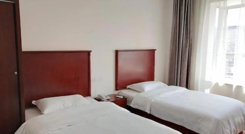 Bed in GreenTree Inn Shanghai Changxing Island Yuansha Fishing Port Hotel