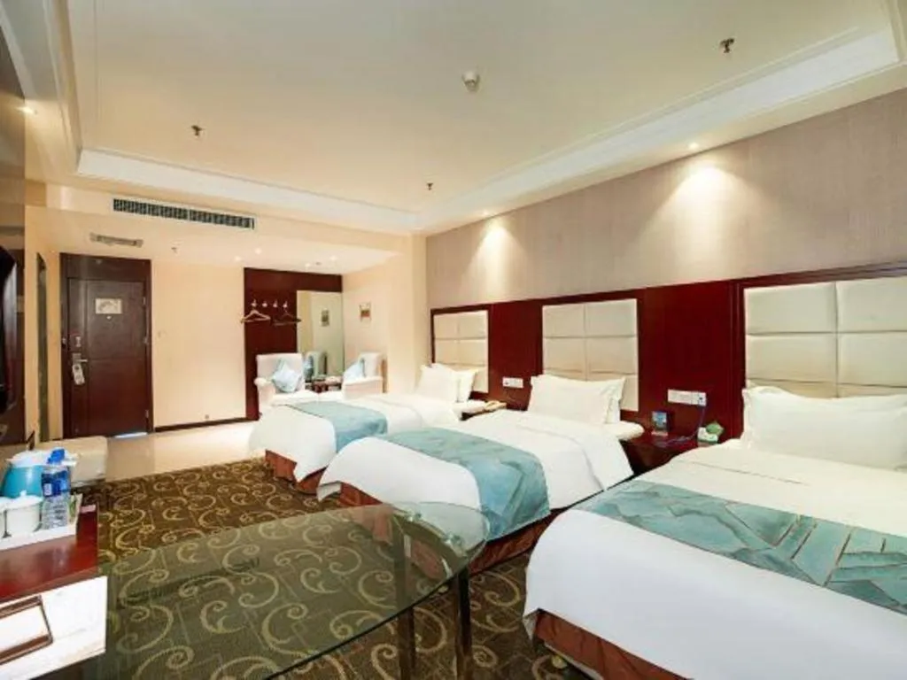 Bed in Xinxiang Zhongzhou Yihe Hotel