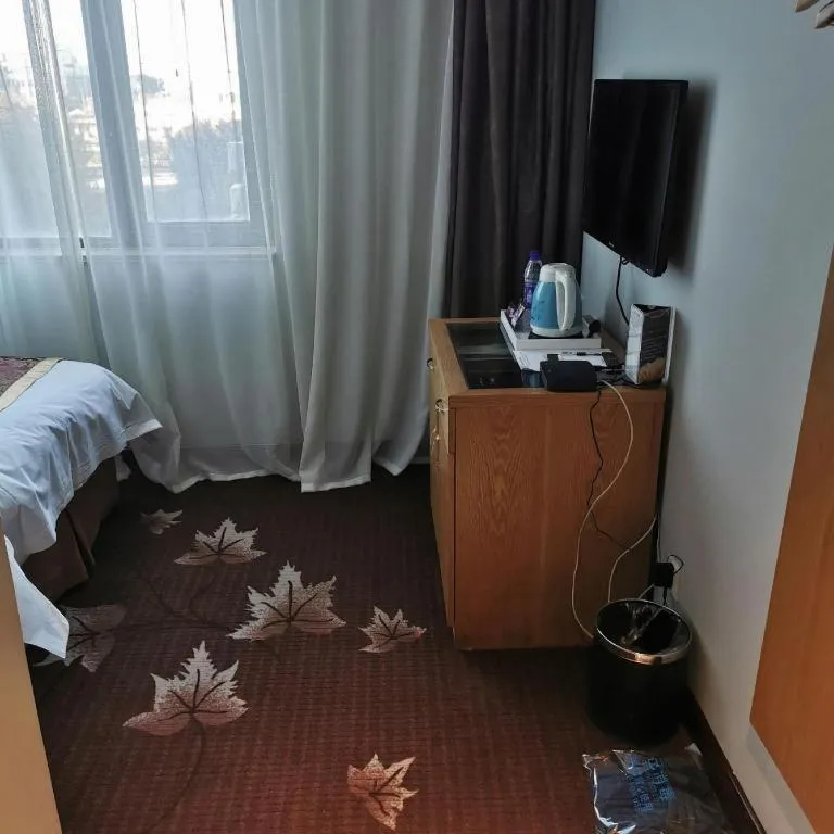 Bed in Xinxiang Zhongzhou Yihe Hotel