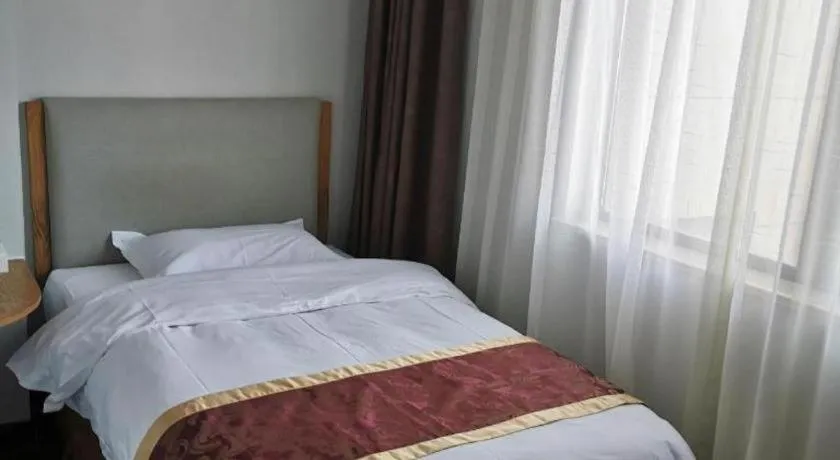Bed in Xinxiang Zhongzhou Yihe Hotel