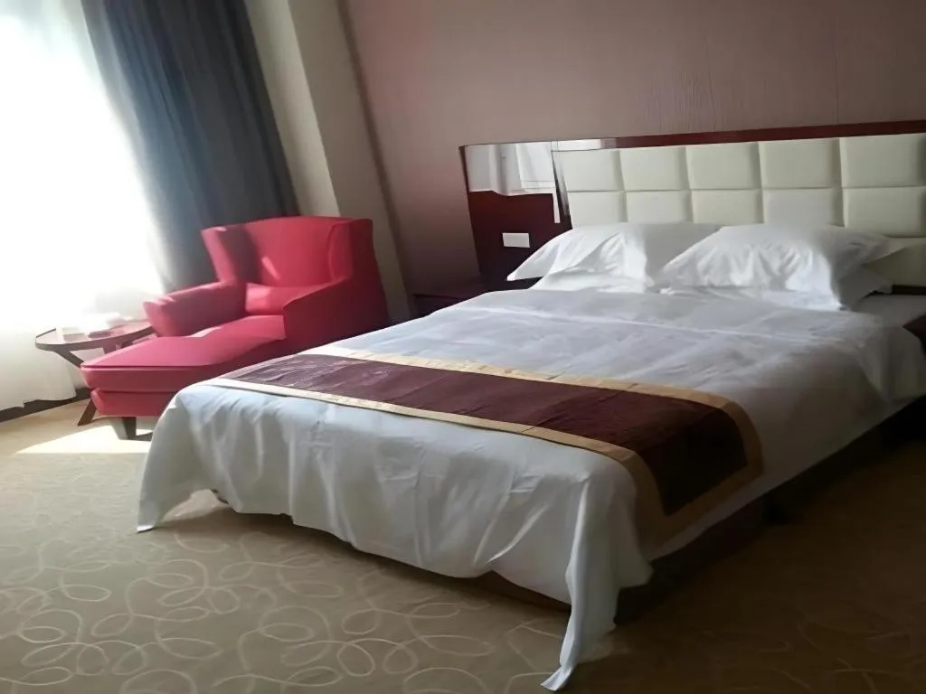 Bed in Xinxiang Zhongzhou Yihe Hotel