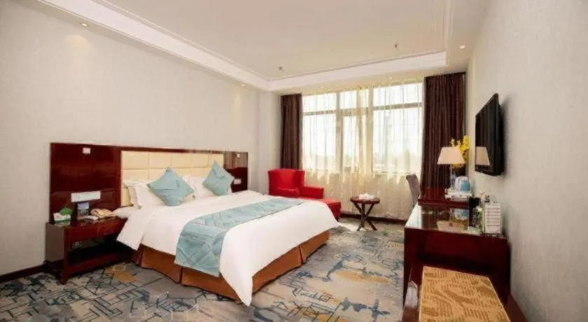 Bed in Xinxiang Zhongzhou Yihe Hotel