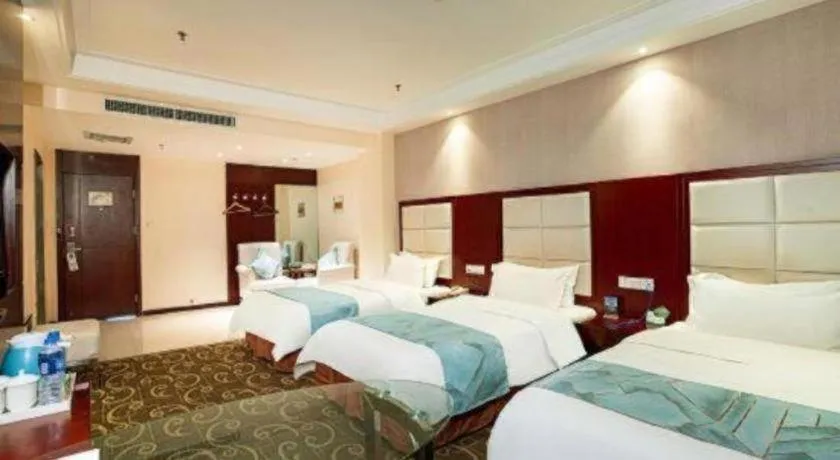 Bed in Xinxiang Zhongzhou Yihe Hotel