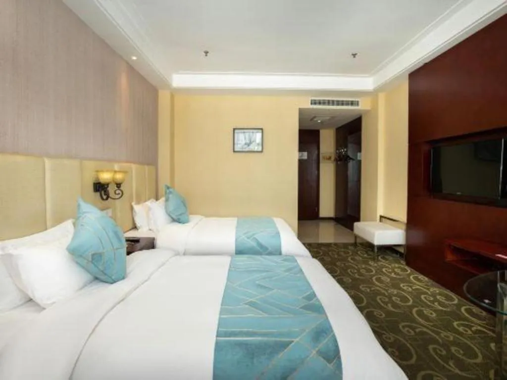 Bed in Xinxiang Zhongzhou Yihe Hotel