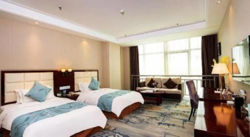 Bed in Xinxiang Zhongzhou Yihe Hotel