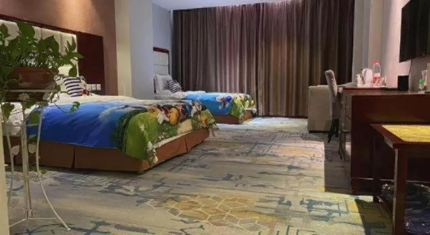 Bed in Xinxiang Zhongzhou Yihe Hotel