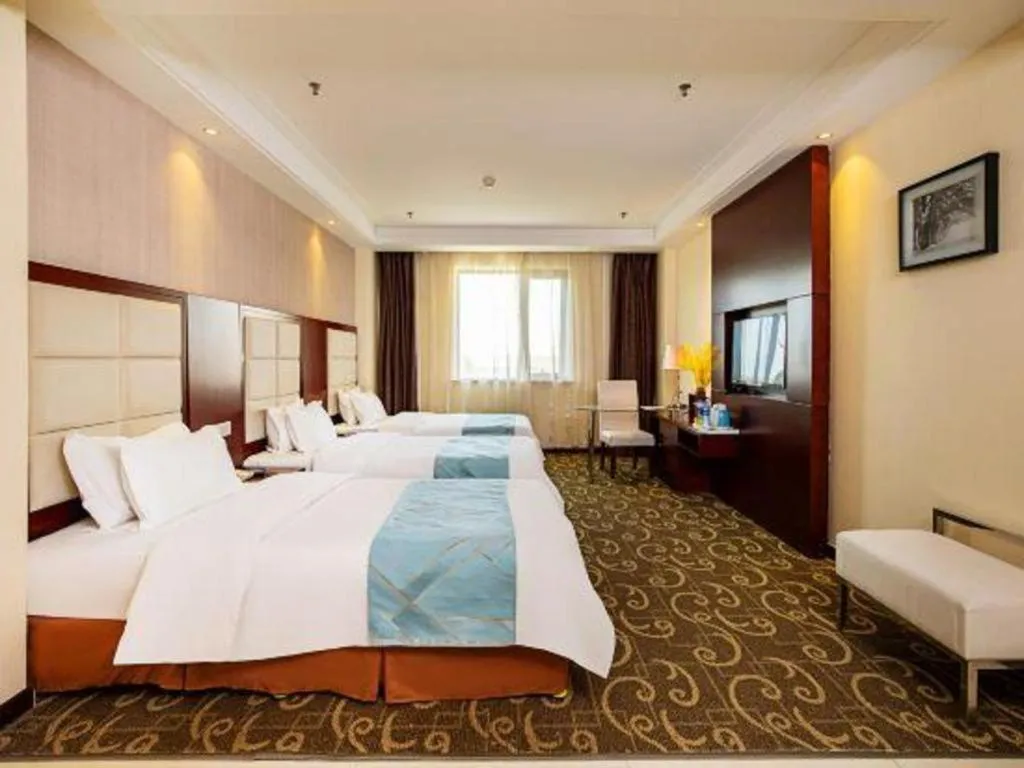 Bed in Xinxiang Zhongzhou Yihe Hotel