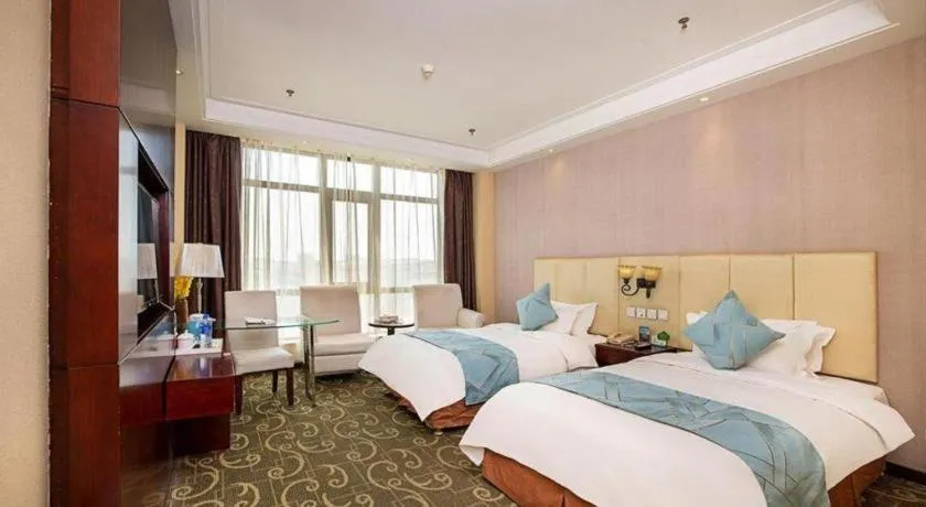 Bed in Xinxiang Zhongzhou Yihe Hotel