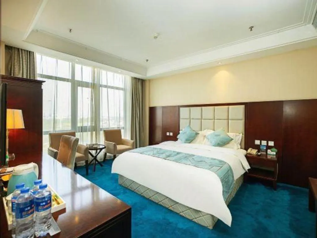 Bed in Xinxiang Zhongzhou Yihe Hotel