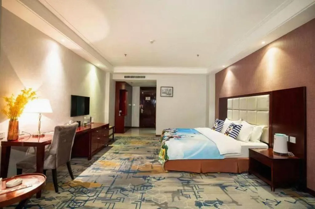 Bed in Xinxiang Zhongzhou Yihe Hotel