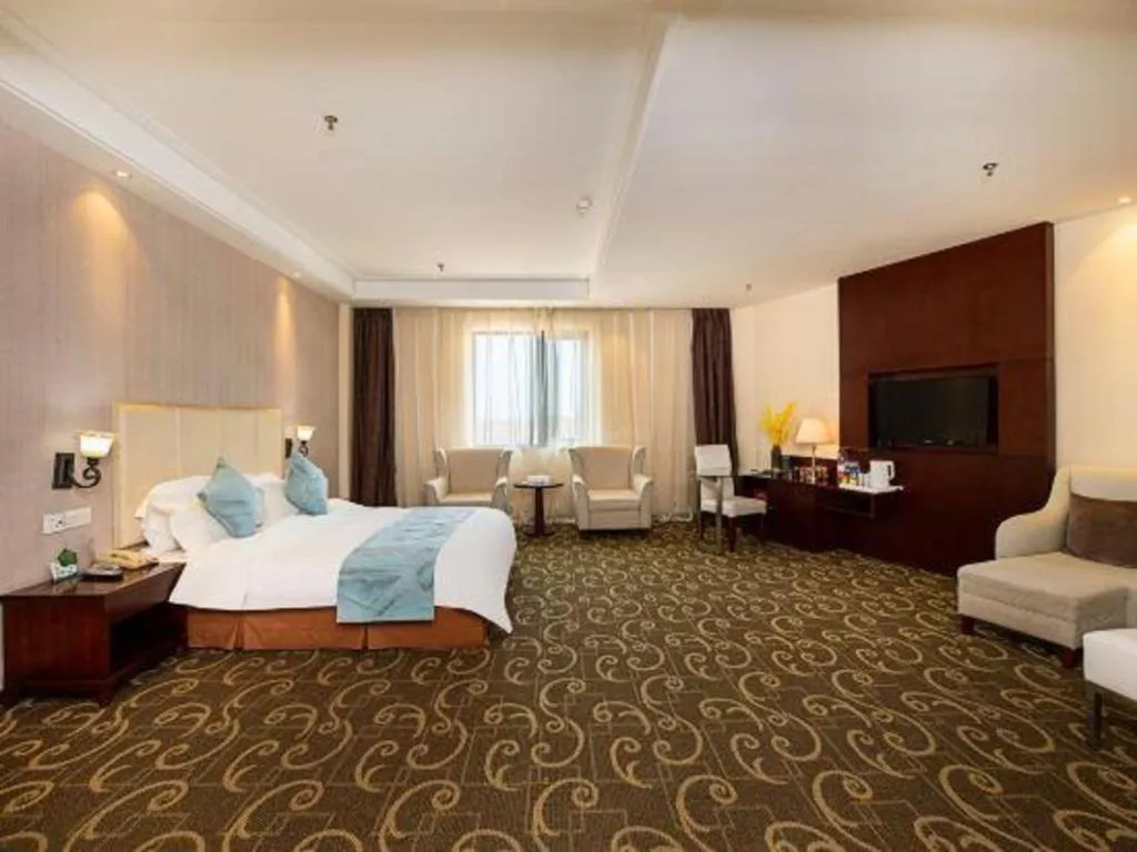 Bed in Xinxiang Zhongzhou Yihe Hotel