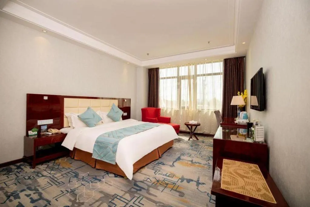 Bed in Xinxiang Zhongzhou Yihe Hotel