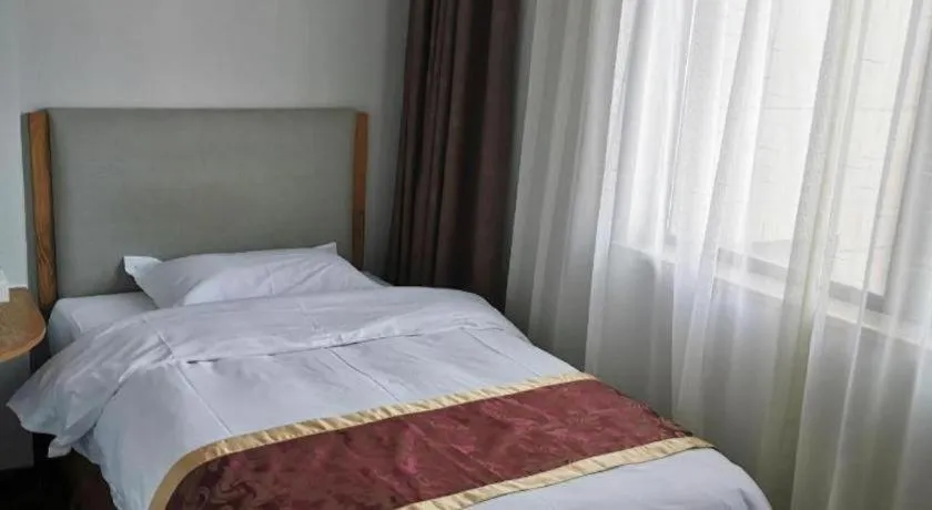 Bed in Xinxiang Zhongzhou Yihe Hotel