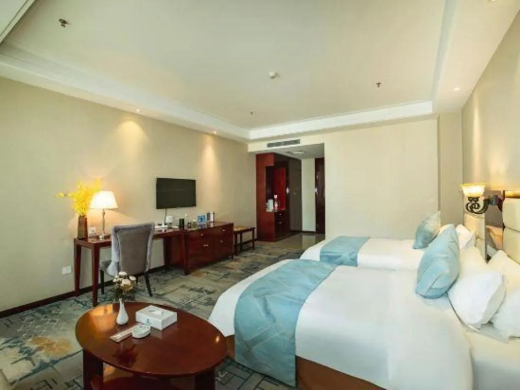 Bed in Xinxiang Zhongzhou Yihe Hotel