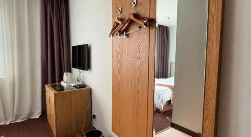 Bed in Xinxiang Zhongzhou Yihe Hotel