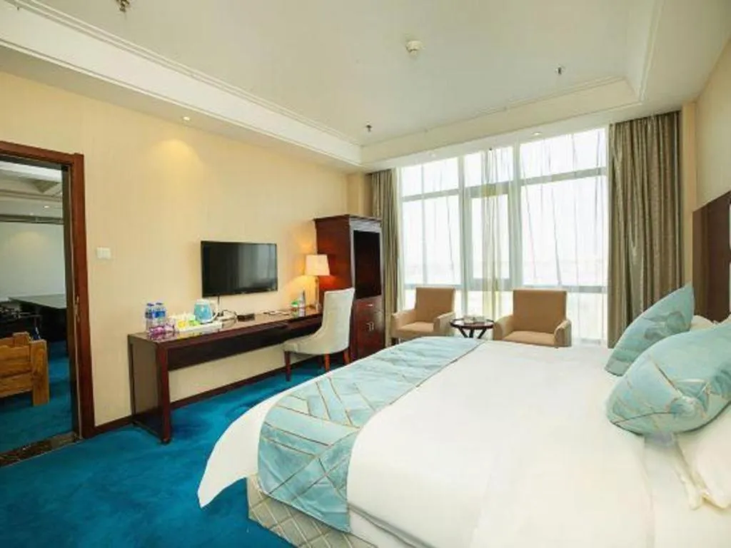 Bed in Xinxiang Zhongzhou Yihe Hotel