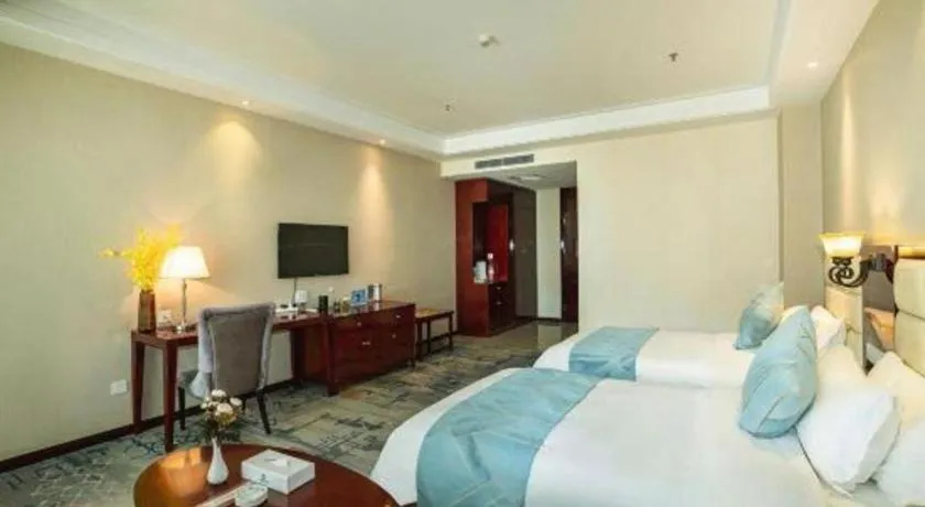 Bed in Xinxiang Zhongzhou Yihe Hotel
