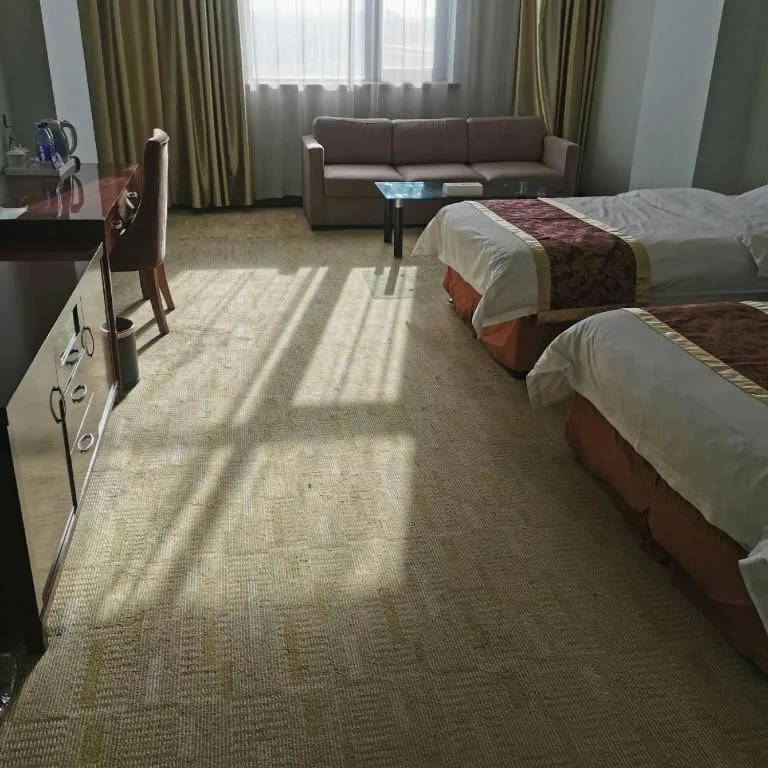 Bed in Xinxiang Zhongzhou Yihe Hotel