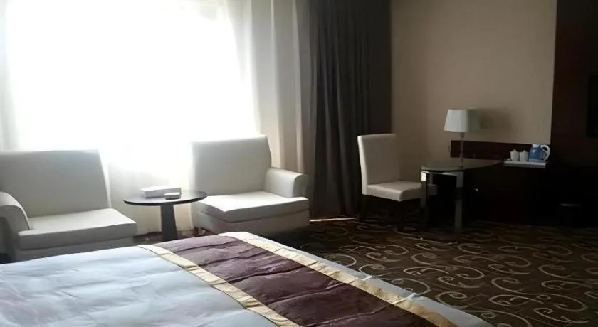 Bed in Xinxiang Zhongzhou Yihe Hotel