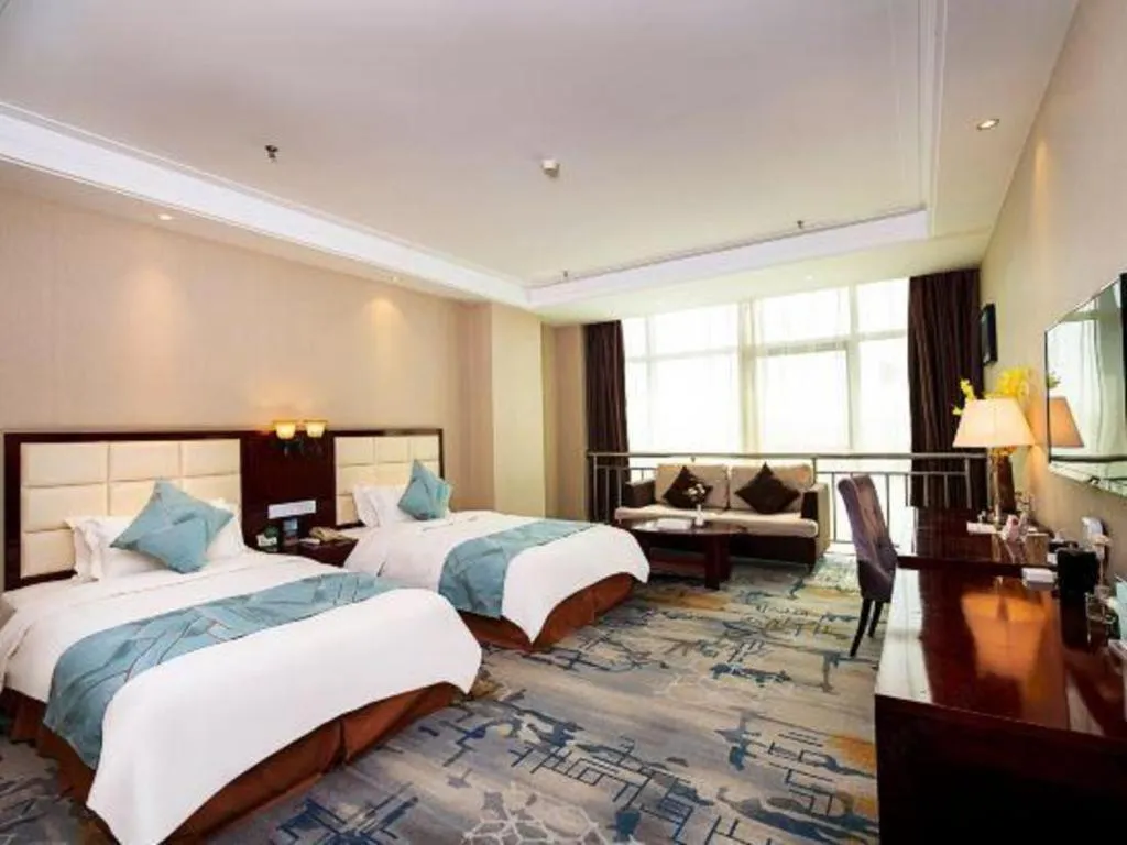 Bed in Xinxiang Zhongzhou Yihe Hotel