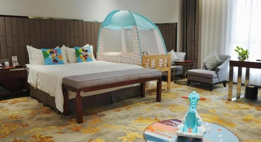 Bed in Jiyuan Oriental Jianguo Hotel