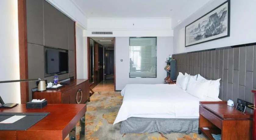 Bed in Jiyuan Oriental Jianguo Hotel