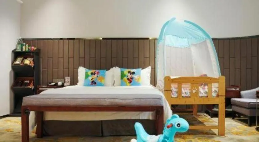 Bed in Jiyuan Oriental Jianguo Hotel