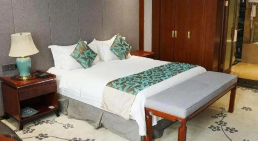 Bed in Jiyuan Oriental Jianguo Hotel