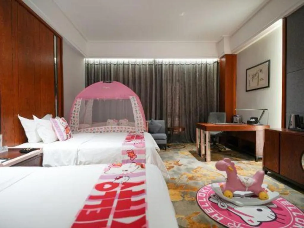 Bed in Jiyuan Oriental Jianguo Hotel