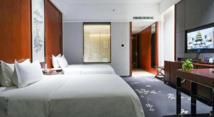 Bed in Jiyuan Oriental Jianguo Hotel