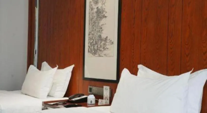 Bed in Jiyuan Oriental Jianguo Hotel