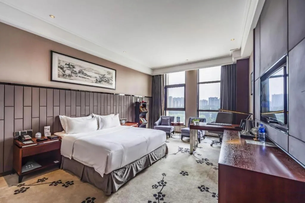 Bed in Jiyuan Oriental Jianguo Hotel