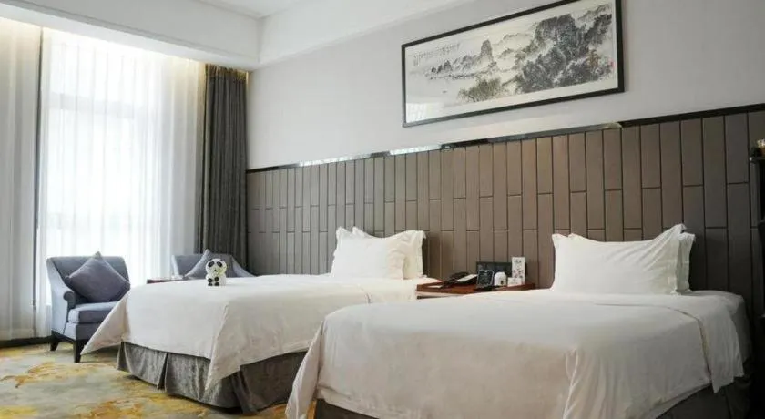 Bed in Jiyuan Oriental Jianguo Hotel