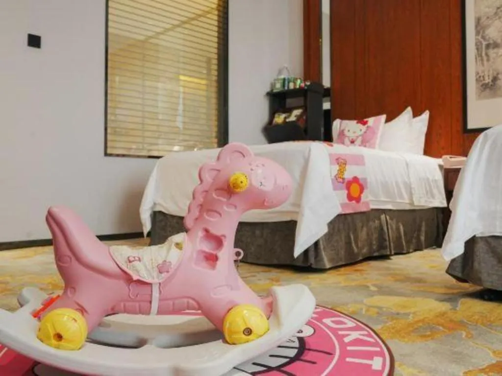 Bed in Jiyuan Oriental Jianguo Hotel