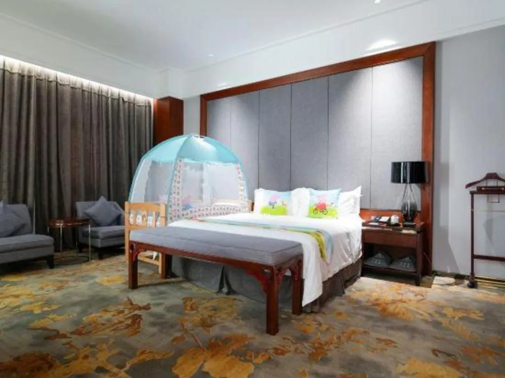 Bed in Jiyuan Oriental Jianguo Hotel