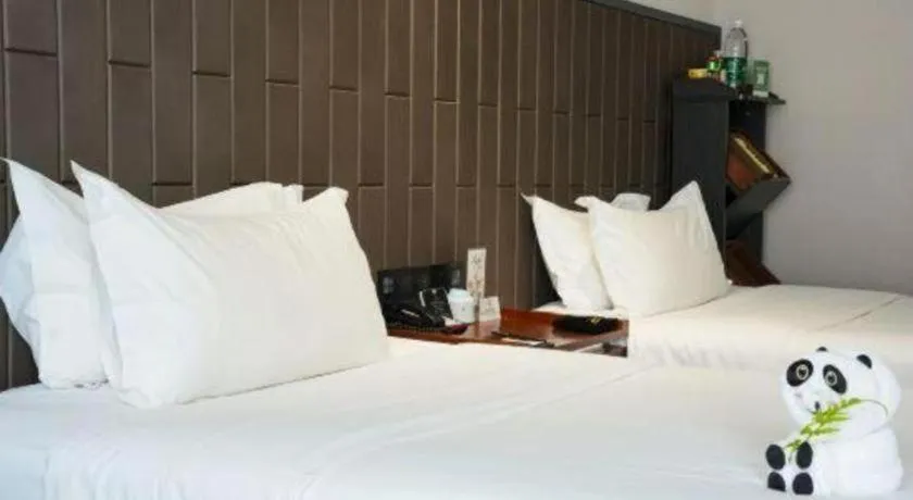 Bed in Jiyuan Oriental Jianguo Hotel