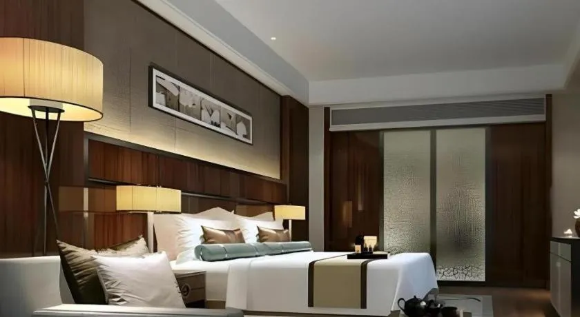 Bed in Jiyuan Oriental Jianguo Hotel