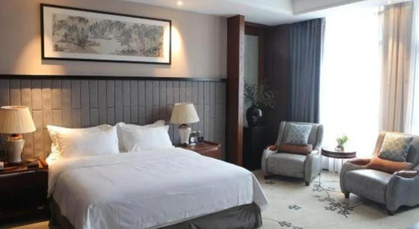 Bed in Jiyuan Oriental Jianguo Hotel