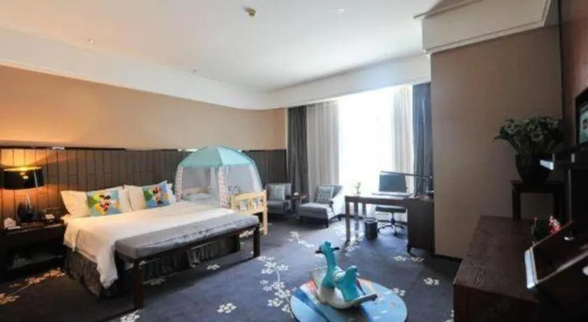 Bed in Jiyuan Oriental Jianguo Hotel