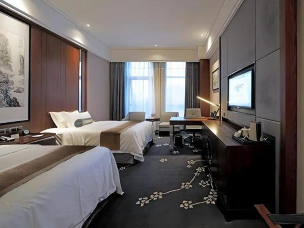 Bed in Jiyuan Oriental Jianguo Hotel