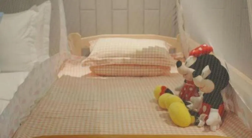 Bed in Jiyuan Oriental Jianguo Hotel