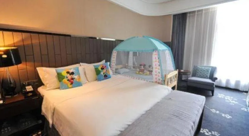 Bed in Jiyuan Oriental Jianguo Hotel