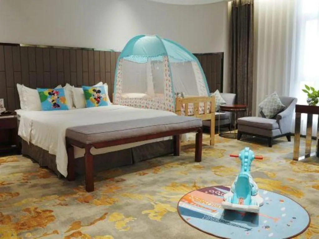 Bed in Jiyuan Oriental Jianguo Hotel