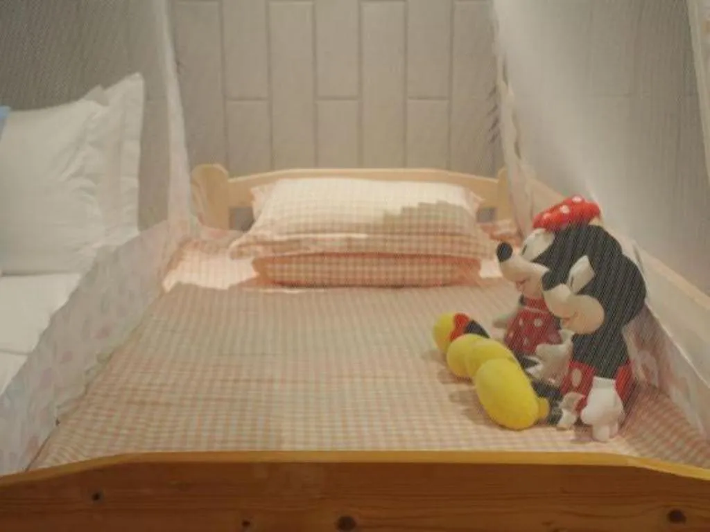 Bed in Jiyuan Oriental Jianguo Hotel