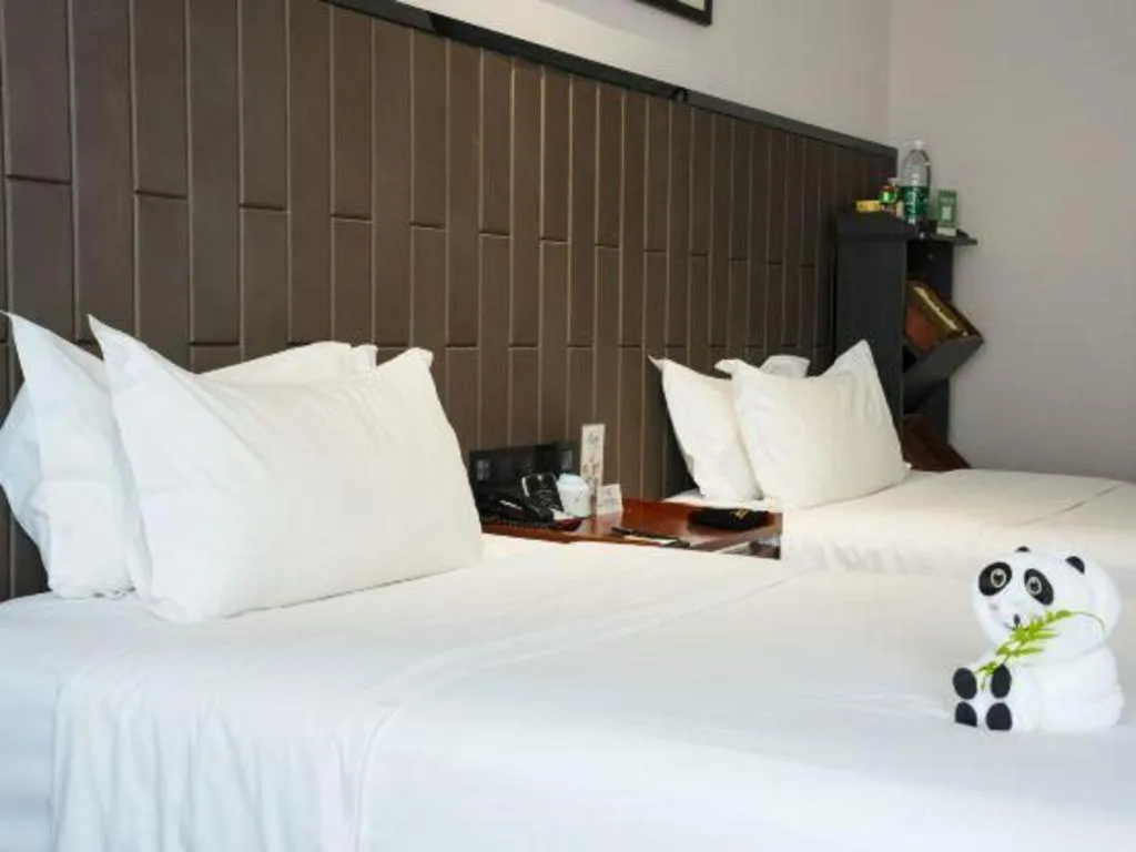 Bed in Jiyuan Oriental Jianguo Hotel