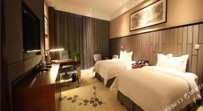 Bed in Jiyuan Oriental Jianguo Hotel