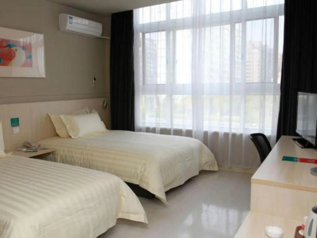 Bed in Jinjiang Inn Tai Zhou Xinghua Yingwu Bridge Branch