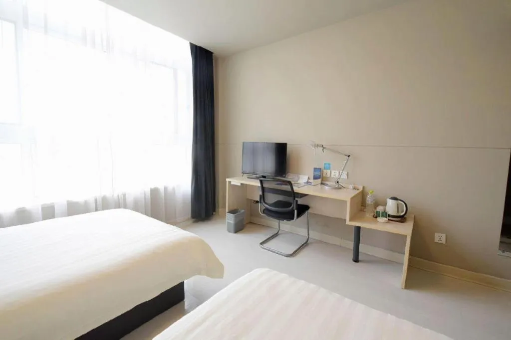 Bed in Jinjiang Inn Tai Zhou Xinghua Yingwu Bridge Branch