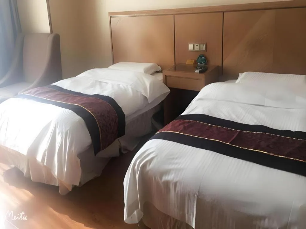 Bed in GreenTree Inn Jiangsu Wuxi Huishan High-Speed Rail Qianzhou Chongwen Road Business Hotel